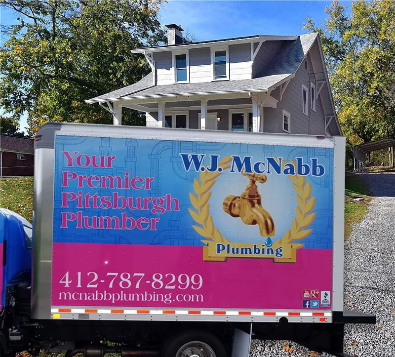 wj mcnabb service plumbing truck backing up into driveway in pittsburg home